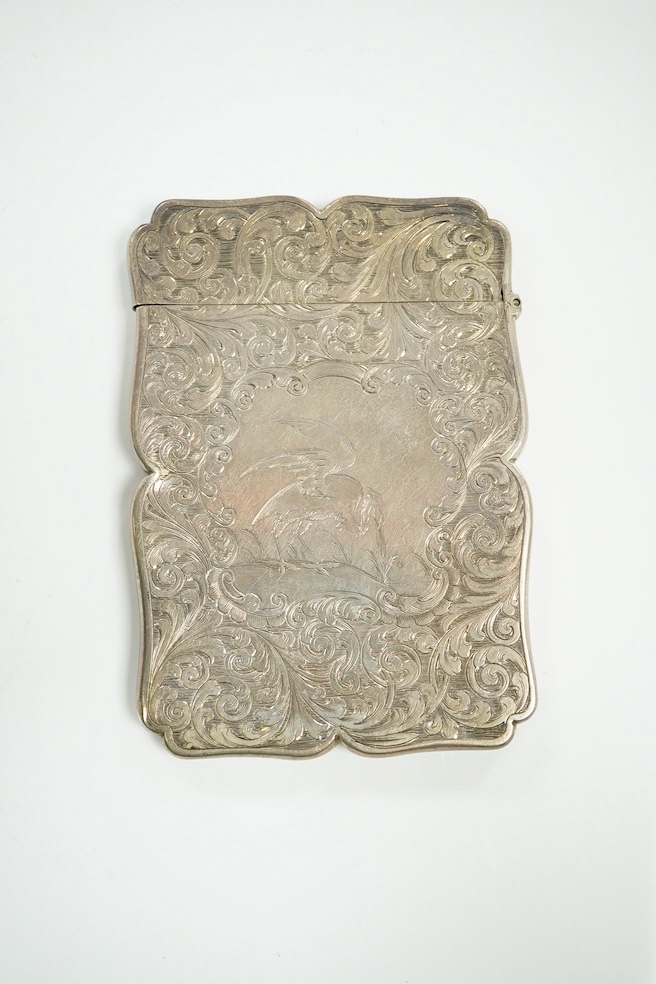 A Victorian silver card case engraved with a heron, maker Nathaniel Mills, Birmingham 1843, in original leather case, another Nathaniel Mills case with foliate scroll engraving, Birmingham 1840, and a silver mounted leat